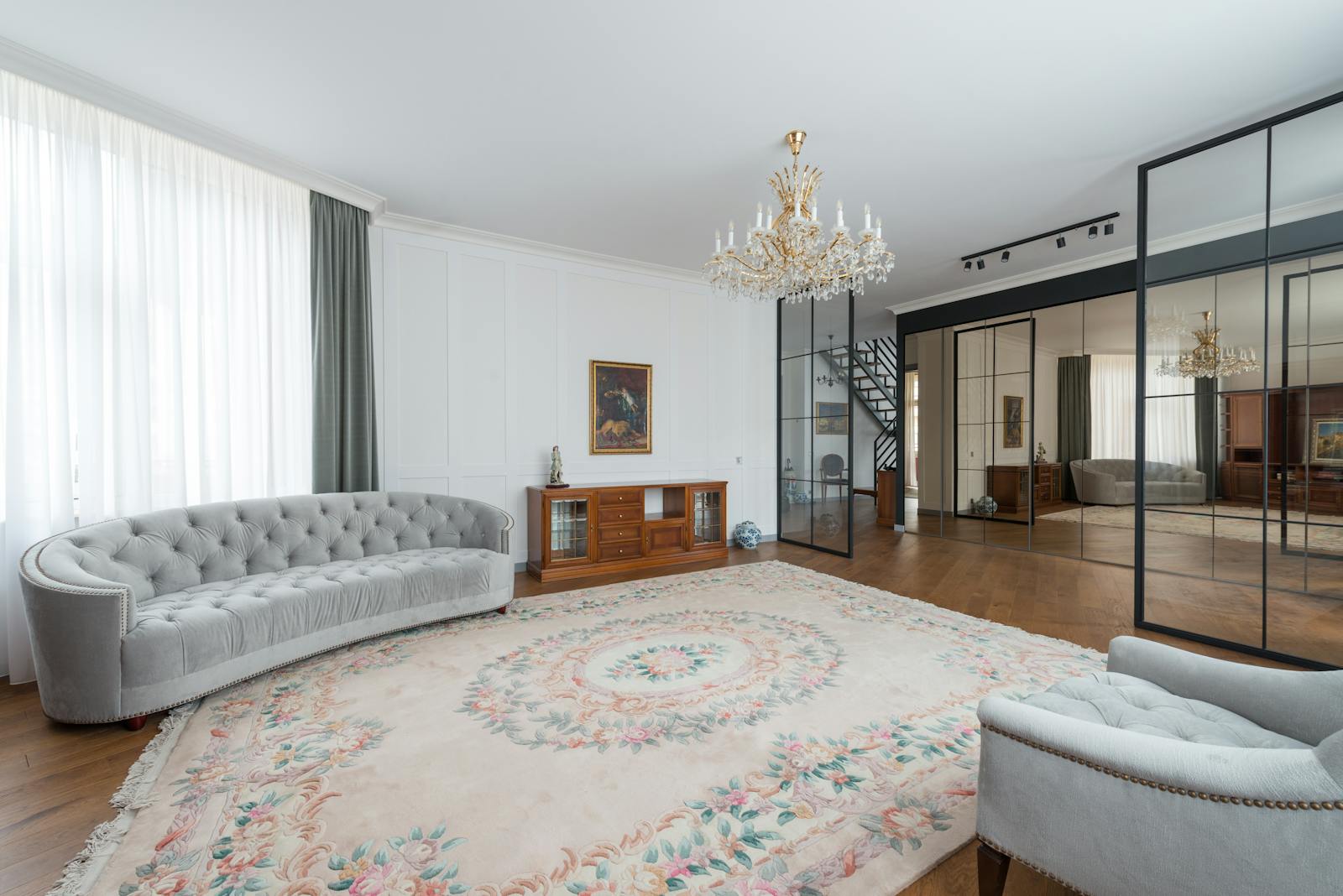A modern and spacious living room featuring elegant decor and luxury furniture.