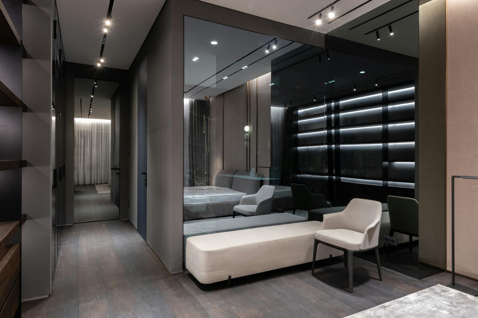 Interior design of bedroom with modern furniture and big mirror on wall in flat